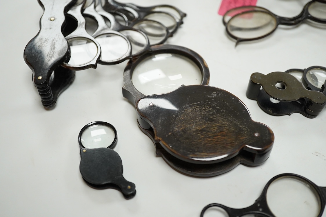 A group of 19th-century horn framed loupes, quizzing glasses and four optician multiple lens sizing lorgnettes (13)
